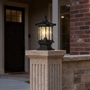 Lantern pillar lights illuminating a brick pathway entrance, providing a warm and inviting glow.