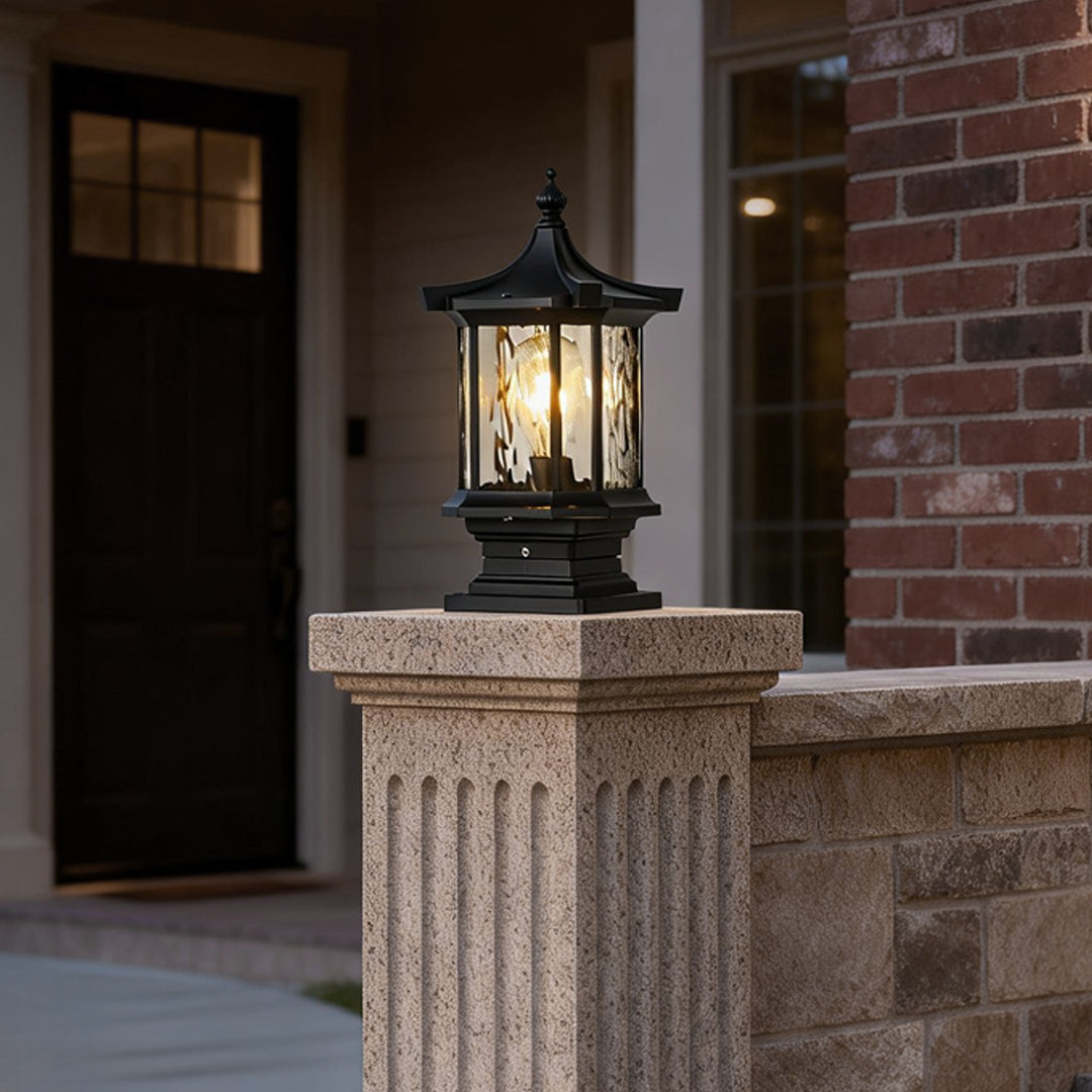 Lantern pillar lights illuminating a brick pathway entrance, providing a warm and inviting glow.
