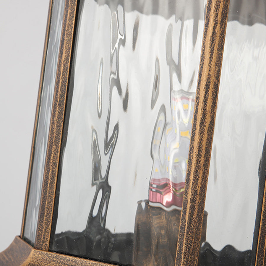 Lantern pillar lights with frosted glass panels, providing gentle light for garden entrances.