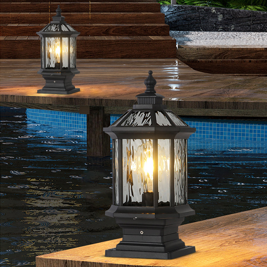 Lantern pillar lights with a solar panel, offering eco-friendly lighting for outdoor spaces.