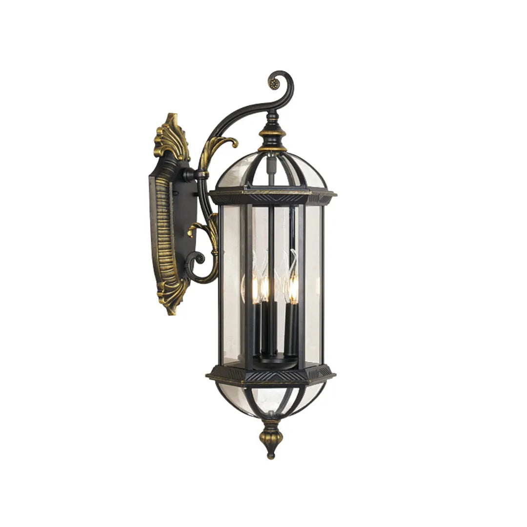 Lantern style outdoor wall light product image on a white background, featuring a vintage black and gold metal finish with clear glass panels.