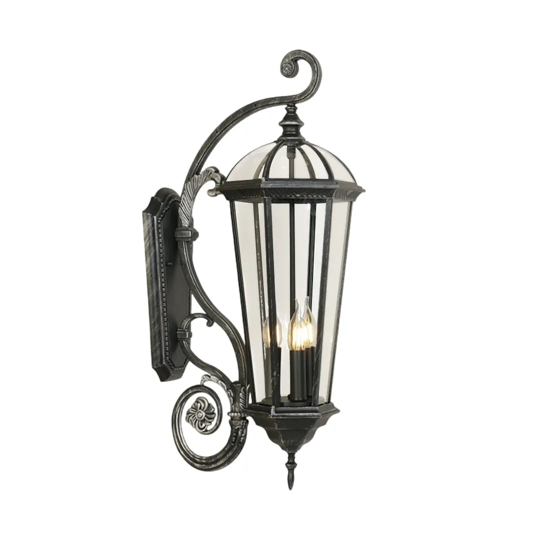 Lantern style wall sconce product image on a white background, featuring a taller vintage lantern design with ornate scroll arm.