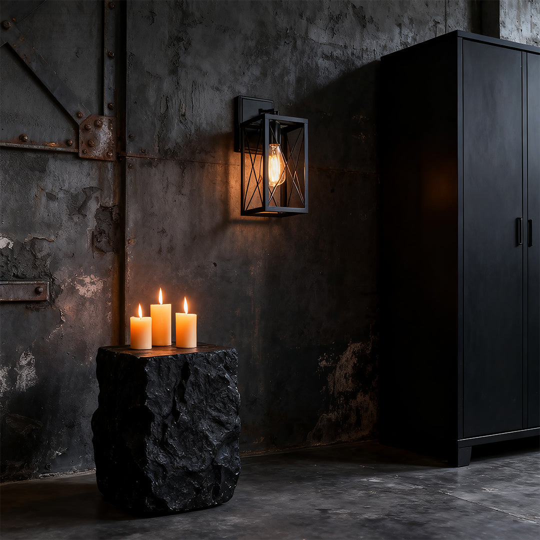 Lantern wall light mounted in a dark-themed room, creating a moody and sophisticated ambiance.