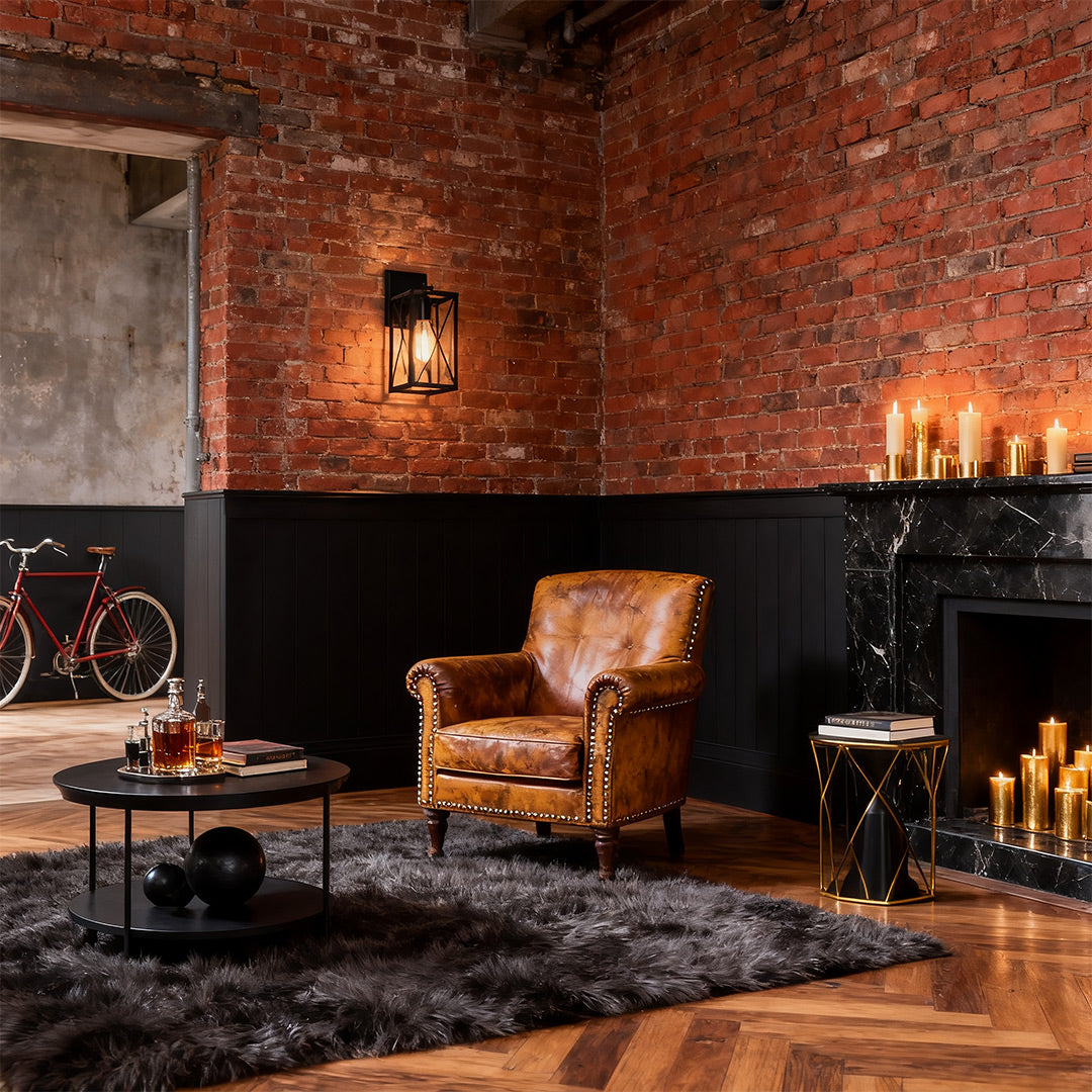 Lantern wall light in a living room with leather armchairs, enhancing the cozy and classic atmosphere.