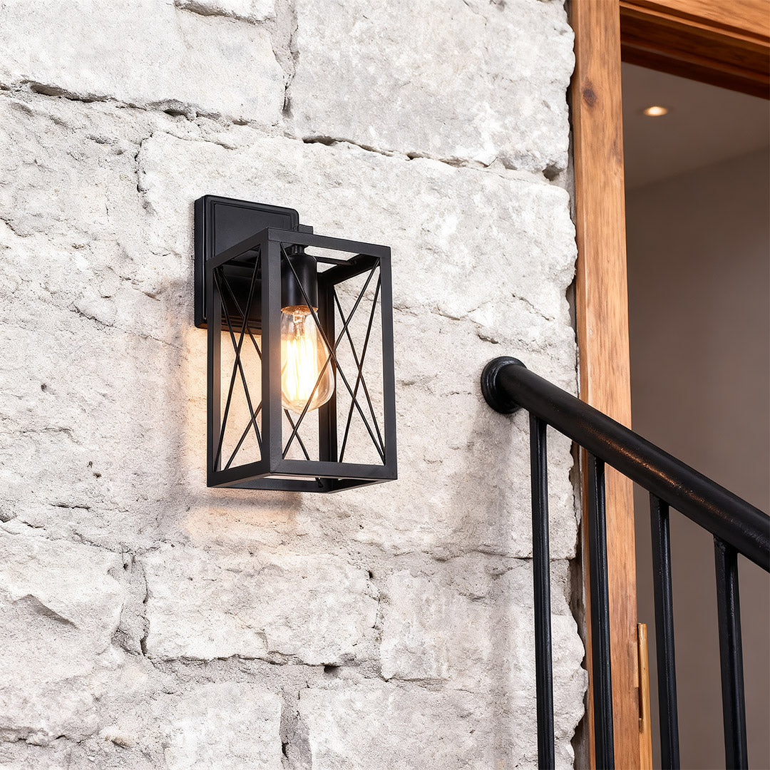 Lantern wall light installed on a white brick staircase wall, adding a stylish and functional touch.