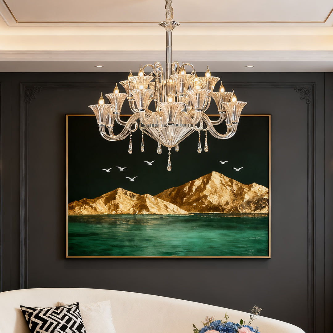 Large art glass chandelier brightening contemporary dining room with dark walls and ocean artwork.