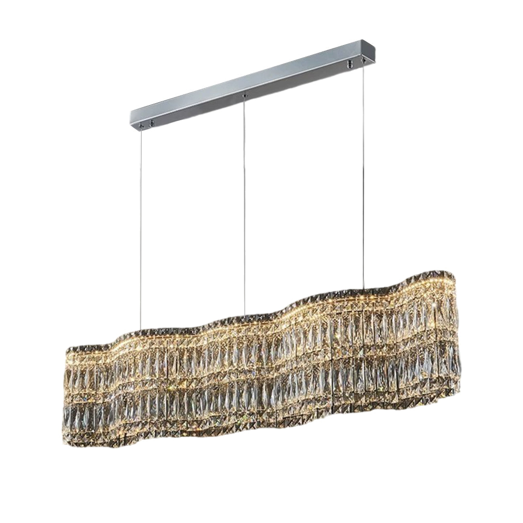Large crystal chandelier with a gold frame, hanging in a luxurious interior setting.