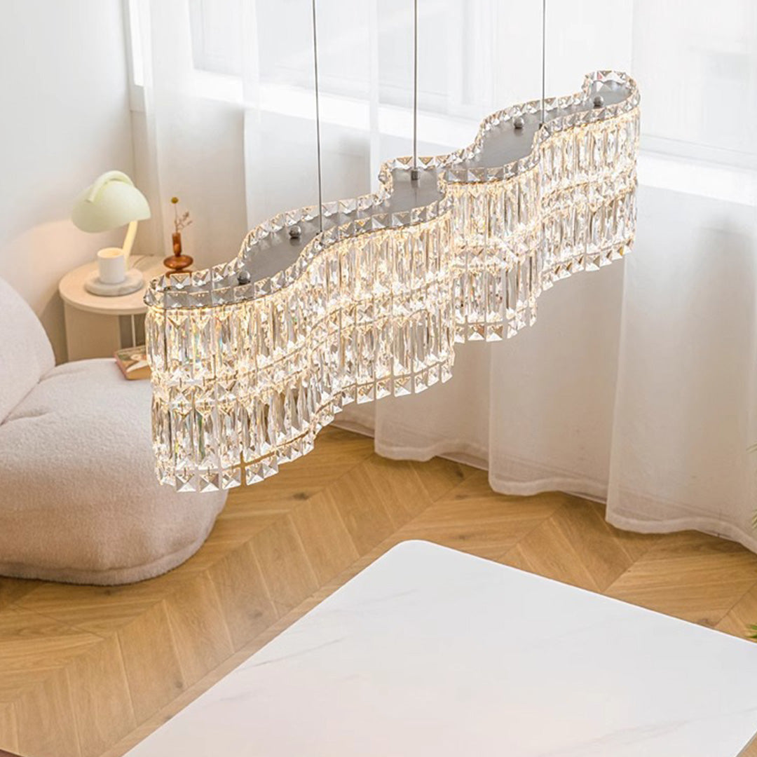 Large crystal chandelier with a gold frame, adding a touch of glamour to a modern living room.