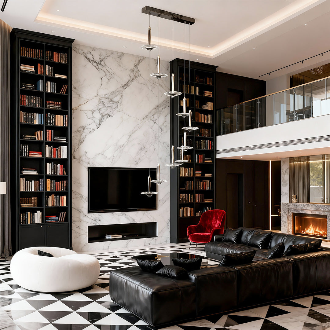 Large crystal pendant light illuminating modern double-height living space with marble walls and contemporary dark furnishings