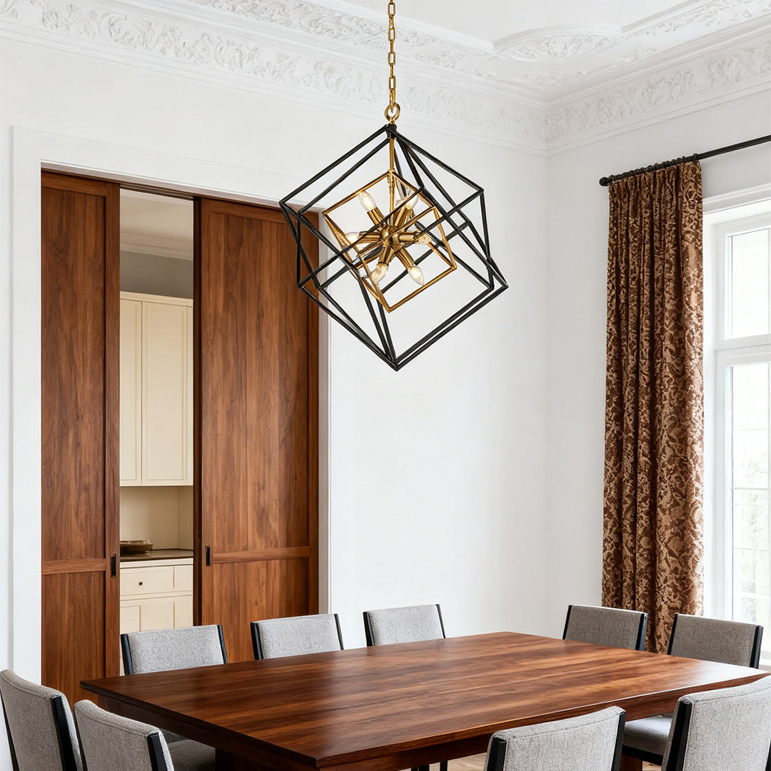 Large geometric square pendant lights with an open black frame and gold inner accent, hanging over a dark wood dining table.