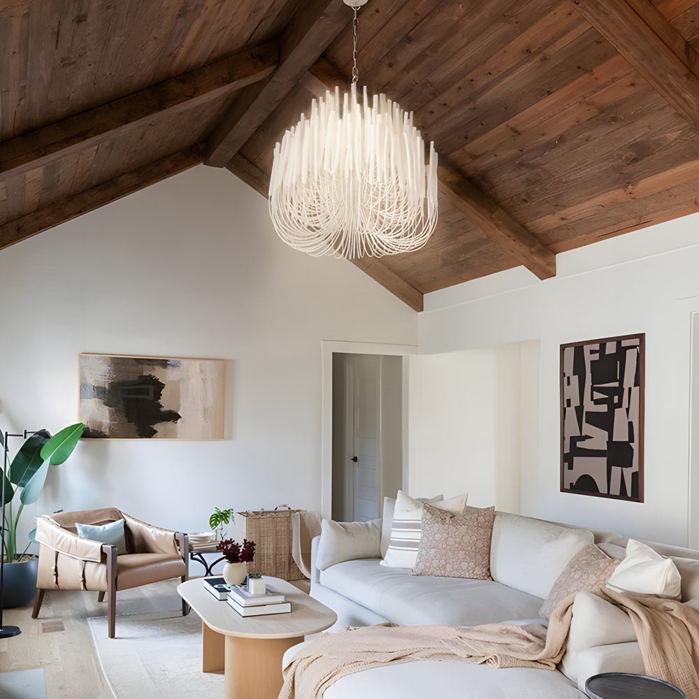 Large glass pendant chandelier in a rustic living room, providing a striking focal point with its natural light.