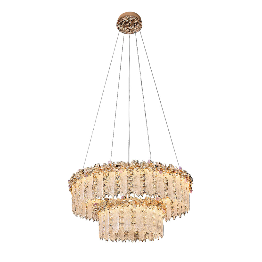 Large gold crystal chandelier with multiple layers of sparkling crystals.