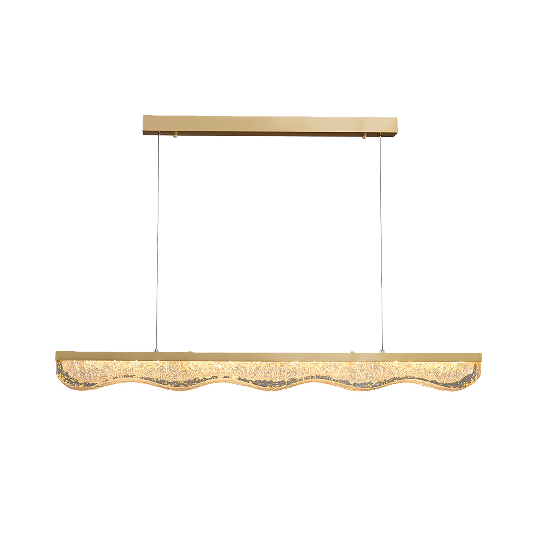 Large gold pendant light with textured crystal glass base suspended by three cables on white background
