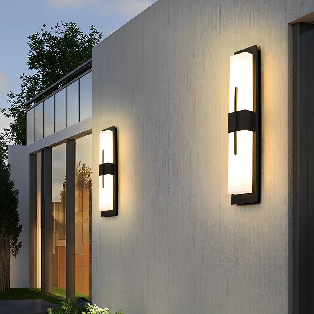 Large outdoor wall light fixture with sleek design, mounted on a white wall.