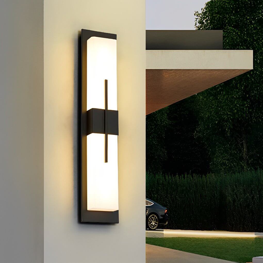 Large outdoor wall light fixtures providing ambient lighting near a modern entrance.
