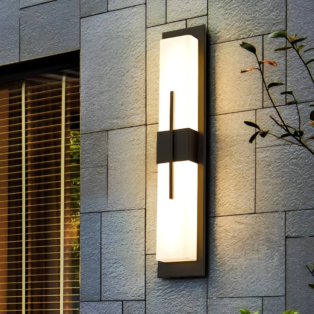 Large outdoor wall light fixtures with rectangular design, mounted on a gray stone wall.
