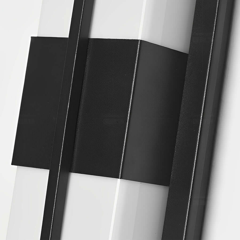Large outdoor wall light fixtures with rectangular shape, providing soft illumination near a garden.