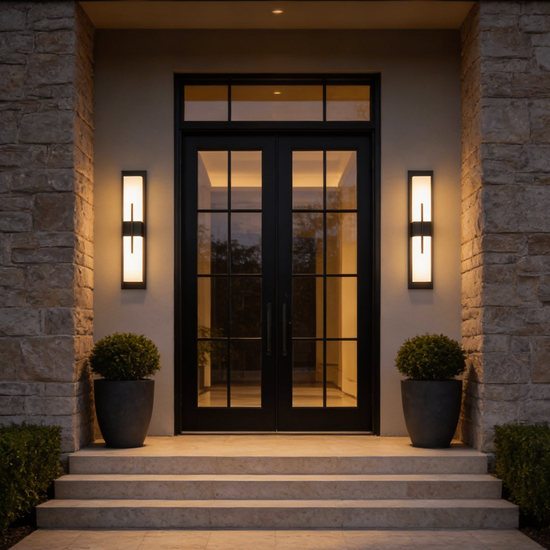 Large outdoor wall light fixtures with sleek black frame, illuminating a modern house entrance.