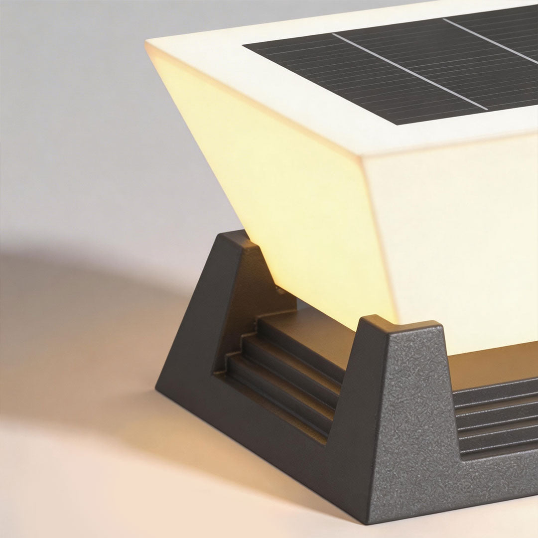 Large pillar lights with a solar panel on top, designed for eco-friendly outdoor lighting.