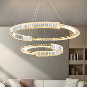 Large-scale gold crystal chandelier with multiple tiers installed in upscale interior design