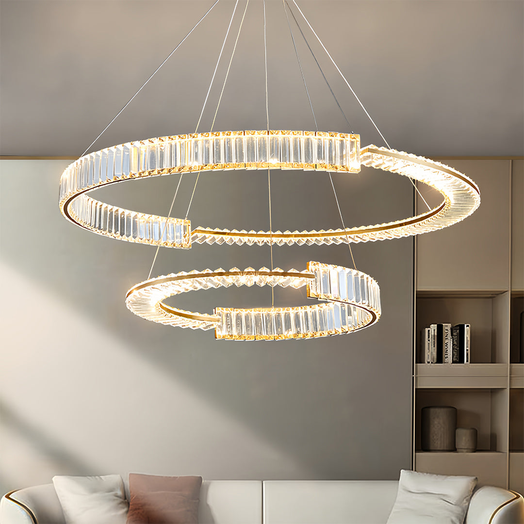 Large-scale gold crystal chandelier with multiple tiers installed in upscale interior design