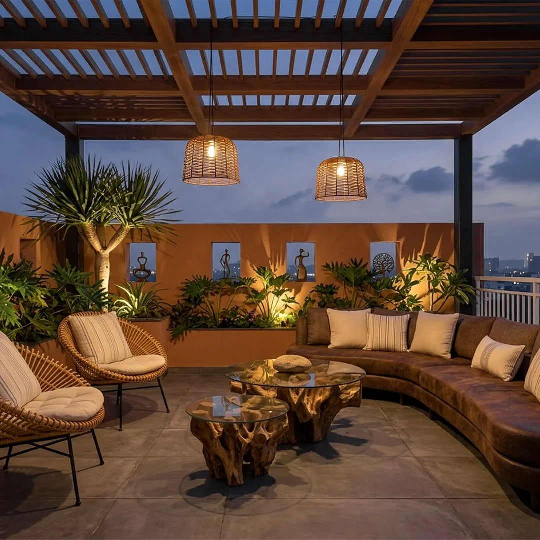 Large woven pendant light adding warm illumination to a cozy outdoor lounge beneath a wood pergola.
