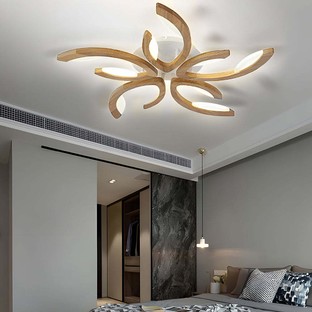 Modern bedroom featuring an artistic leaf ceiling light with flowing curves and warm integrated LED lighting.