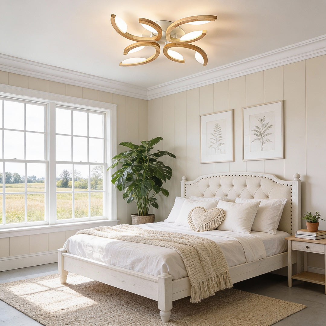 A warm-toned leaf ceiling light illuminating a cozy bedroom with soft natural decor, creating an elegant and calming atmosphere.