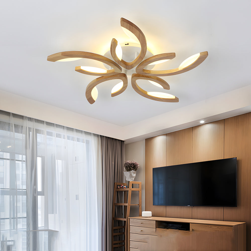 Contemporary media room illuminated by a statement leaf ceiling light, adding visual interest to the ceiling design.