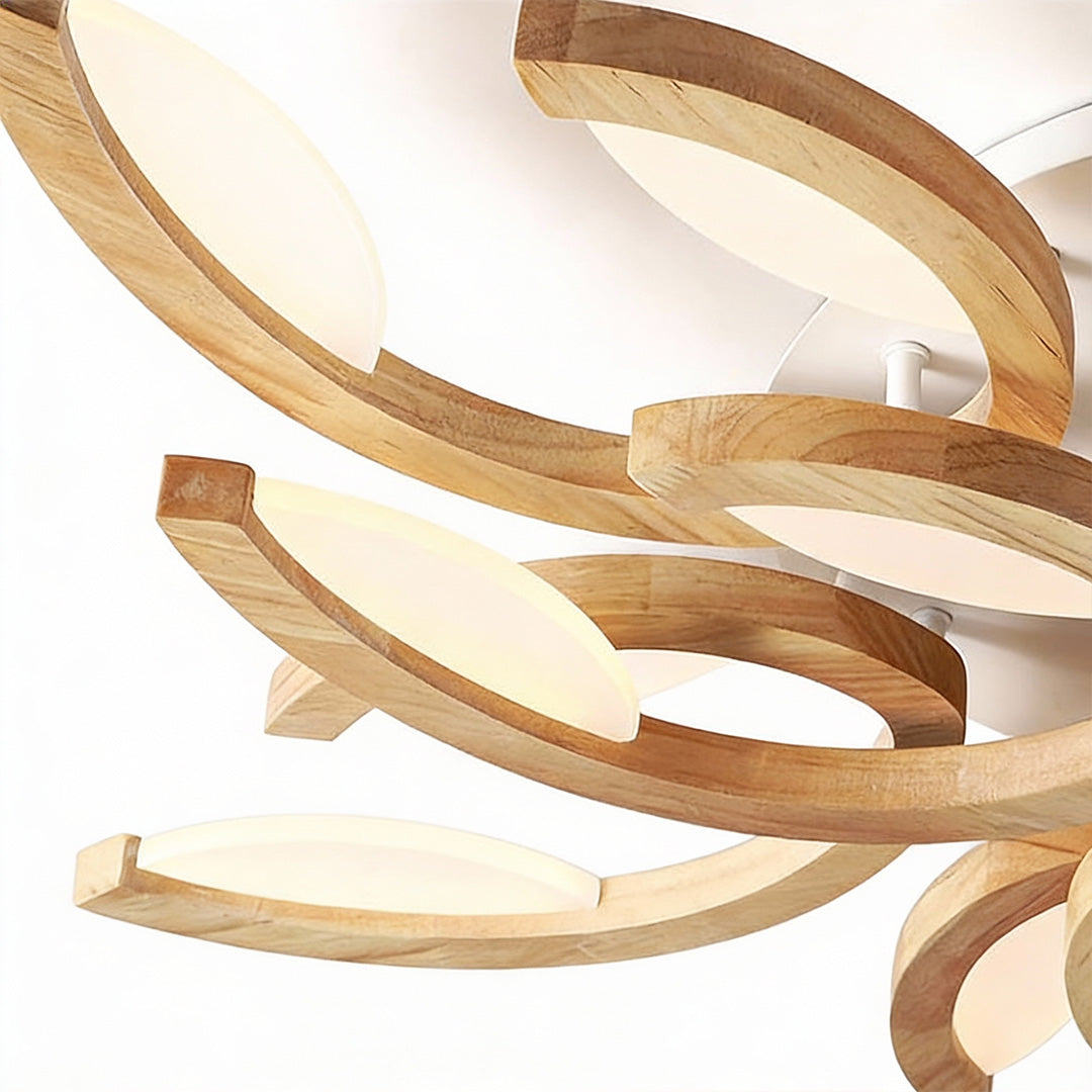 Angled view of the leaf ceiling light highlighting layered leaf-like shapes and smooth warm light output.