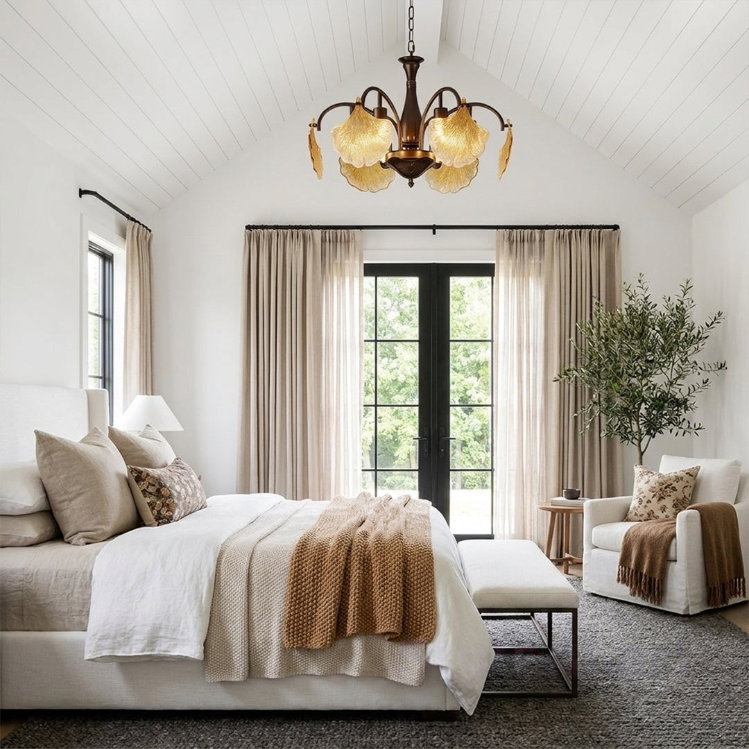 Leaf glass chandelier installed in a bright bedroom with decorative amber glass shades.