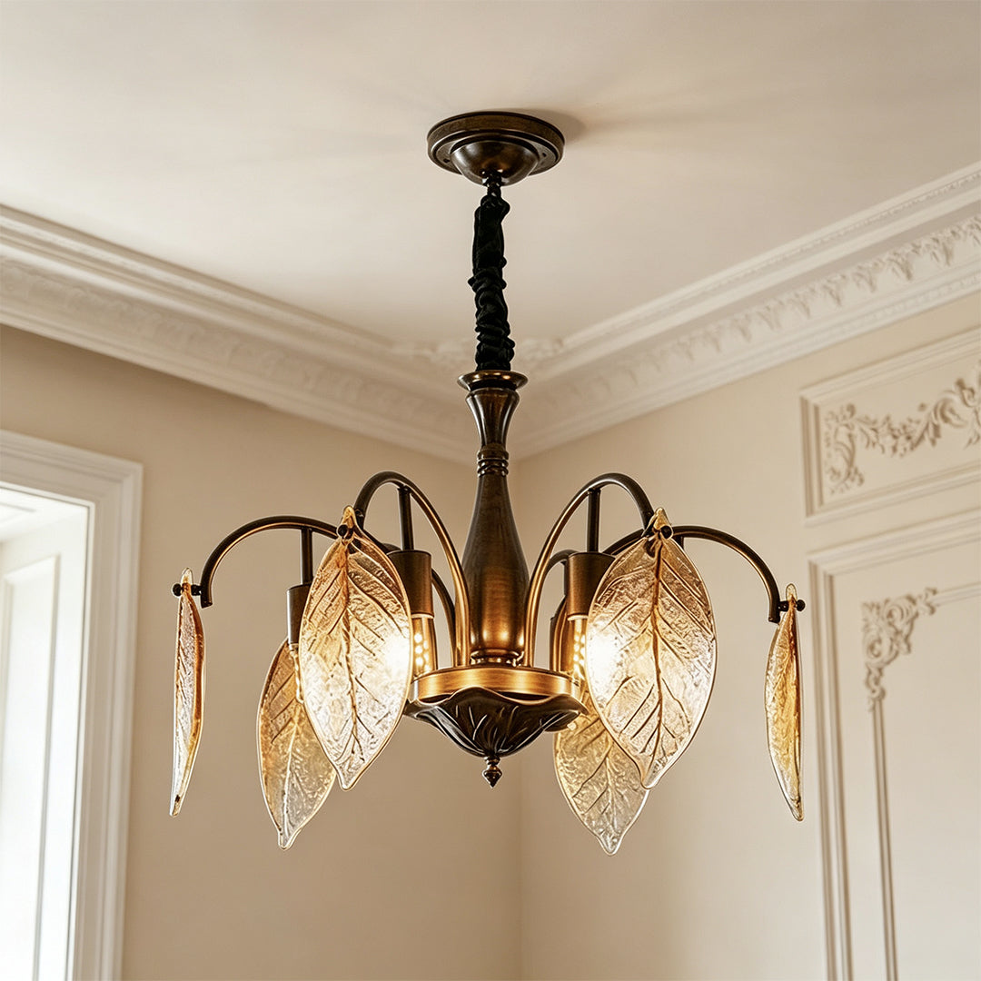 Leaf glass chandelier installed in an elegant room with warm ambient lighting.
