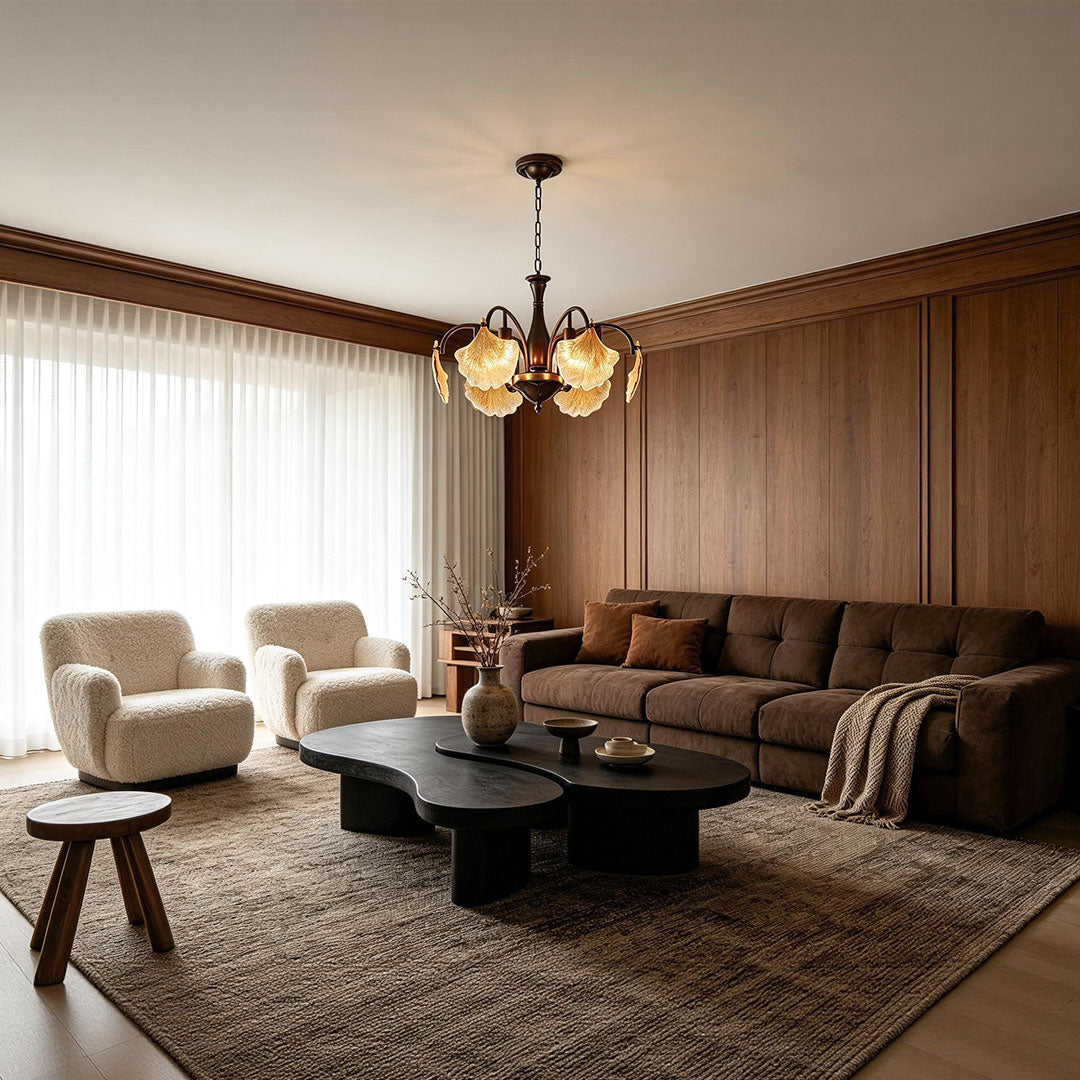 Leaf glass chandelier creating a warm focal point in a contemporary living room.