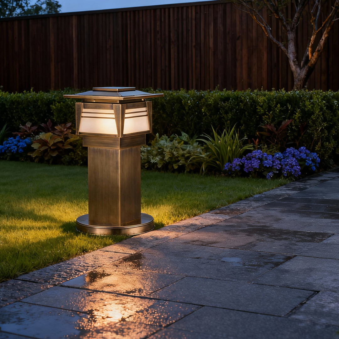 LED bollard garden lights lining a wet stone pathway after rain, offering functional illumination with a modern aesthetic.