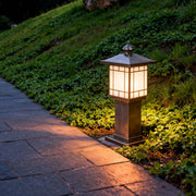 LED bollard landscape lighting illuminating a sloped garden walkway, enhancing visibility and landscape aesthetics at night.