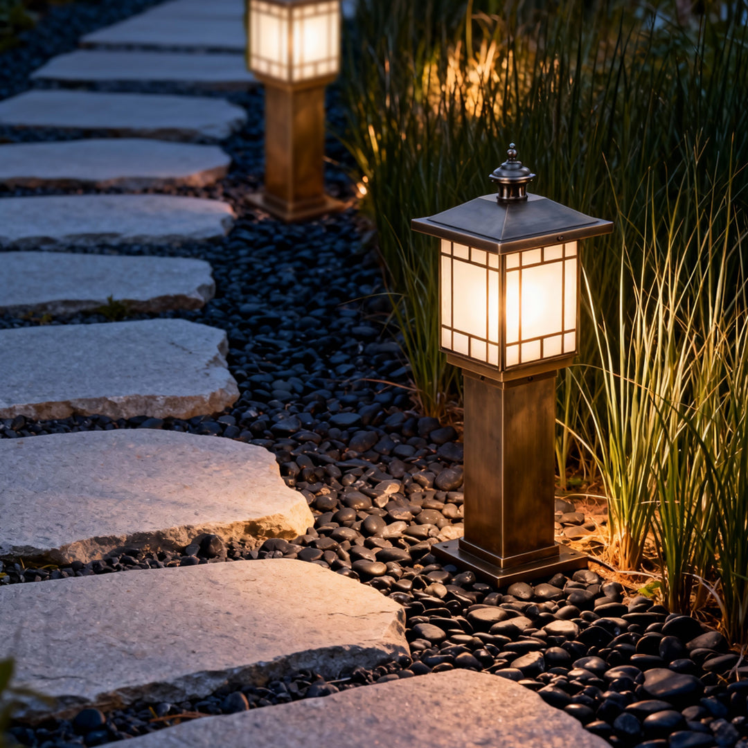 LED bollard landscape lighting placed beside stepping stones, creating elegant and functional outdoor pathway lighting.