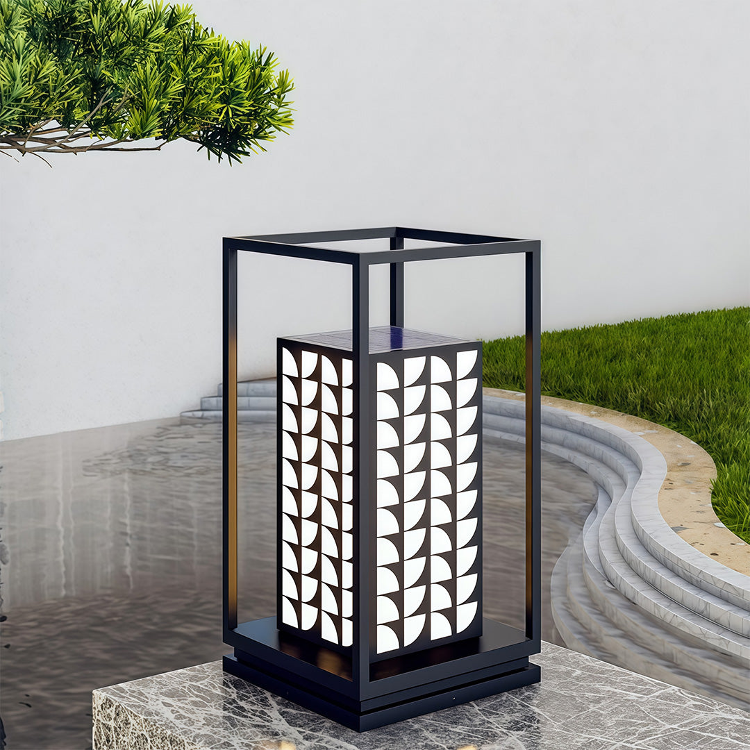 LED bollard light illuminating a water feature in the garden, providing both function and design.