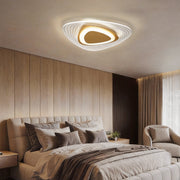 Triangle led ceiling lights installed in a modern bedroom with warm ambient lighting.