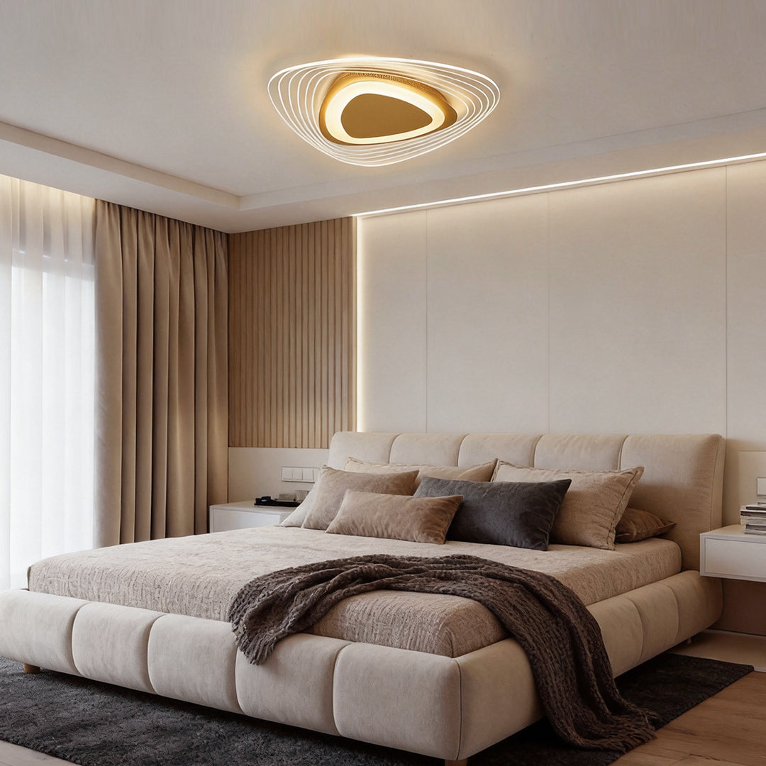 Triangle led ceiling lights mounted above a large bed in a contemporary bedroom.
