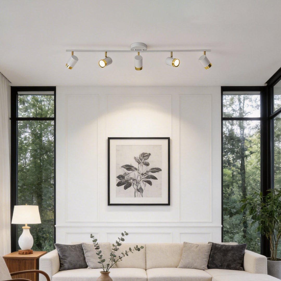 LED ceiling track spotlights providing focused illumination in a contemporary bedroom setting.