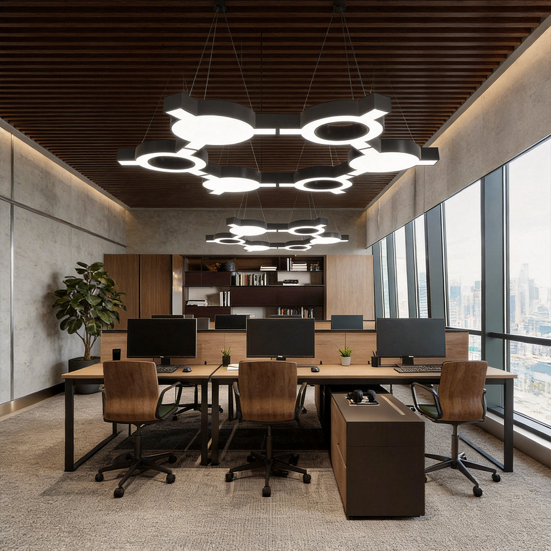 Led chandelier modern suspended in a creative workspace with wood ceiling, combining circular LED forms for warm and balanced illumination.