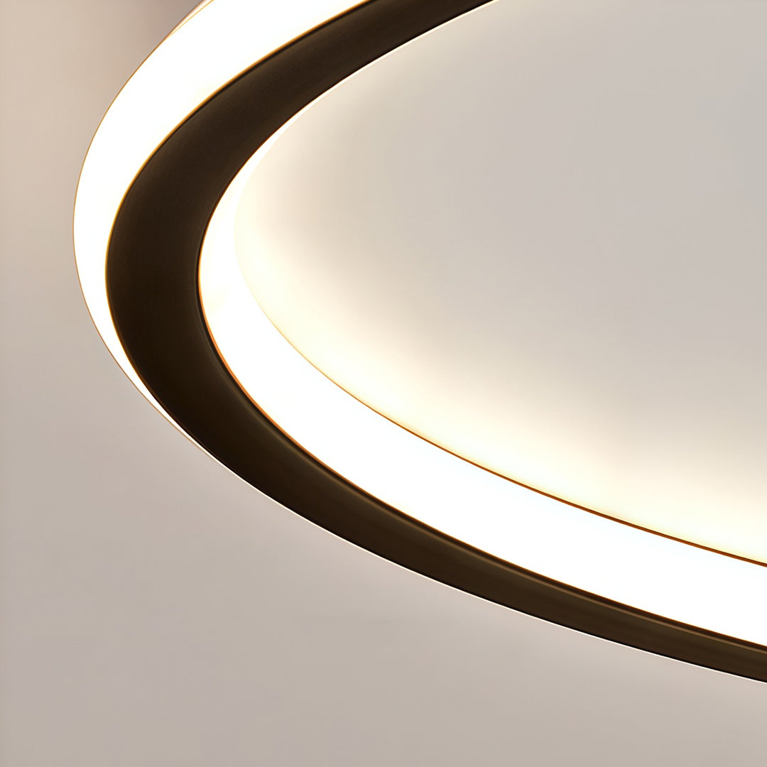 Close-up detail of led circle ceiling lamp showing curved frame and soft light diffusion.