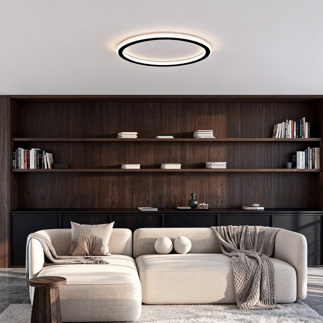 Cozy living space with built-in shelving highlighted by a modern led circle ceiling lamp.