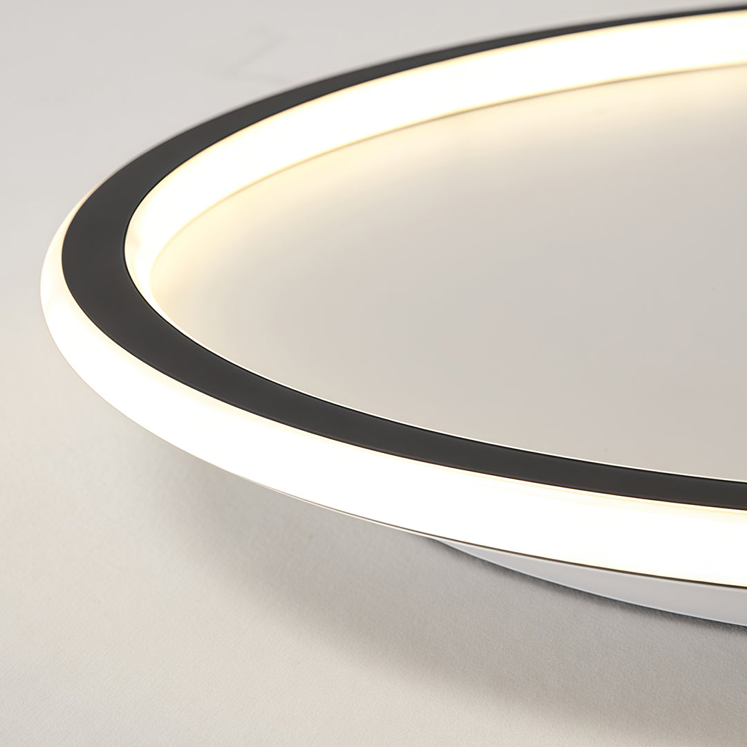 Side angle view of a slim led circle ceiling lamp with warm ambient edge lighting.