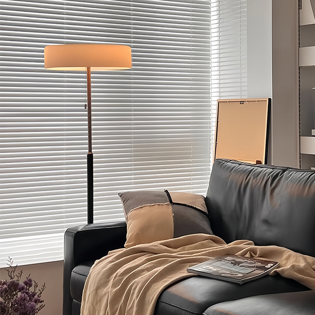 LED floor lamp casting warm light patterns in contemporary bedroom environment