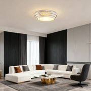 Round LED flush mount lighting illuminating a modern living room.