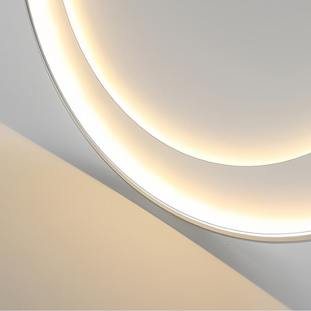 Close-up detail of LED round flush mount light showing ring design and warm ambient glow
