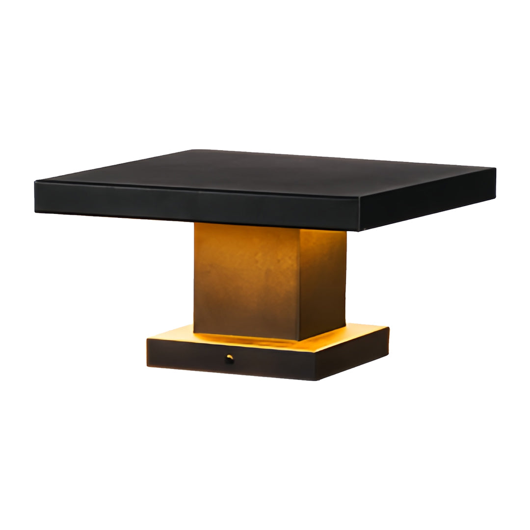 Perspective product image of a minimalistic led gate pillar light showing its black shade and gold base.
