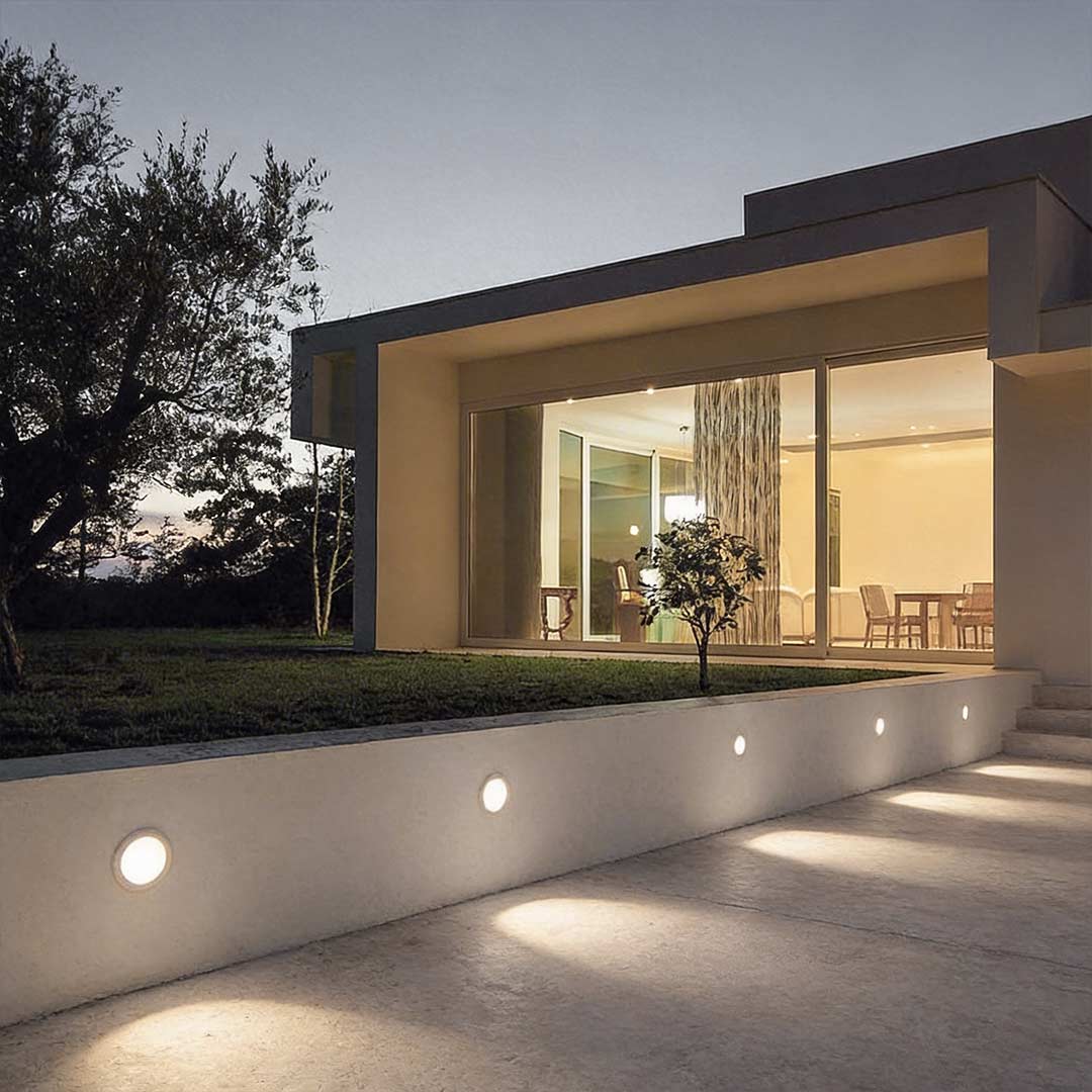 LED ground lights outdoor enhancing a contemporary garden entrance with elegant directional light.
