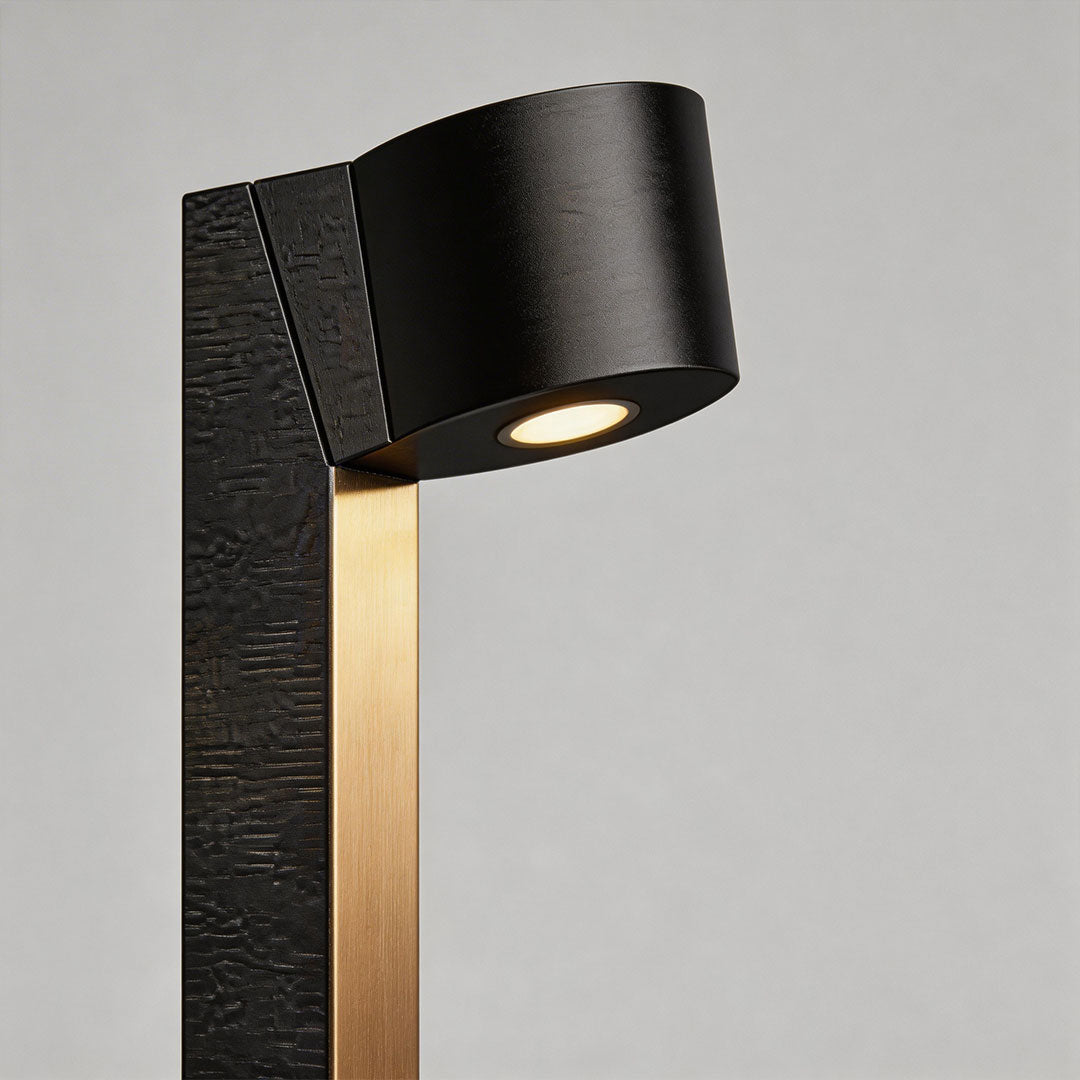 Close-up of LED landscape path lighting with a black metal post and angled downward light head.